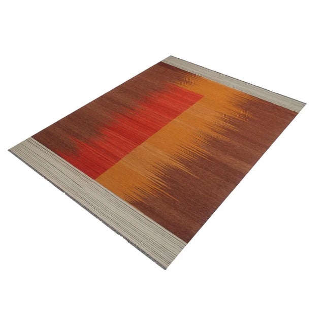 Add a touch of elegance to your home with this casual chic hand woven Tribal Kilim wool rug. Constructed on a loom by...