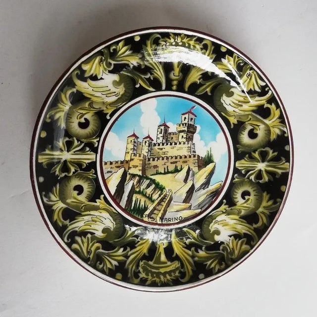 This centerpiece plate is decorated with a view of the city of San Marino. It was produced by the ceramic brand Titano. It...