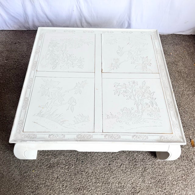 A serene fusion of Eastern elegance and coastal ease, this vintage Ming-style coffee table features delicately carved...