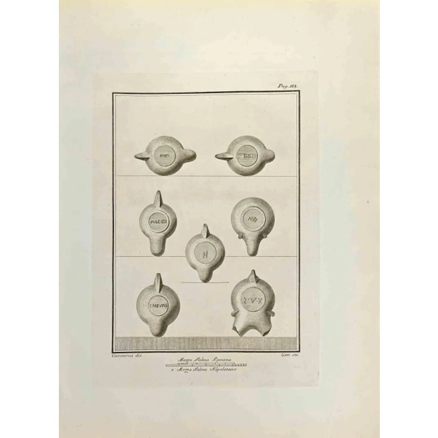 Objects with Roman Majuscule Cursive from "Antiquities of Herculaneum" is an etching on paper realized by Carlo Ceri in...