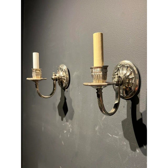 A pair of circa 1920’s small Caldwell silver plated one light sconces