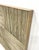 These are weathered gray wood headboards in a textural waffle pattern. They have a great vacation home feel the them ....