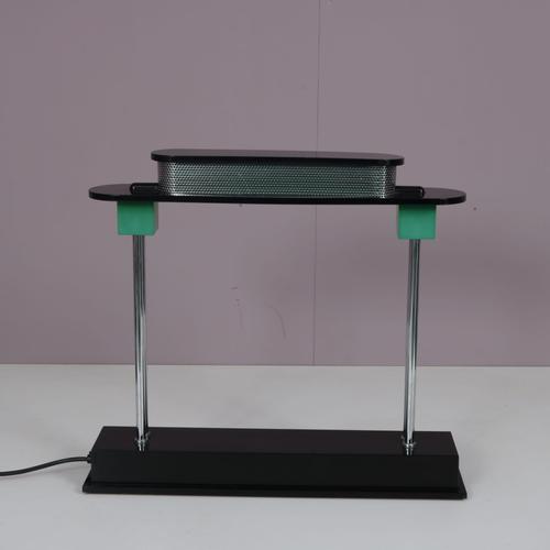 An iconic lamp designed by Ettore Sottsass, manufactured by Artemide in Italy around 1980. This eye-catching piece is a...