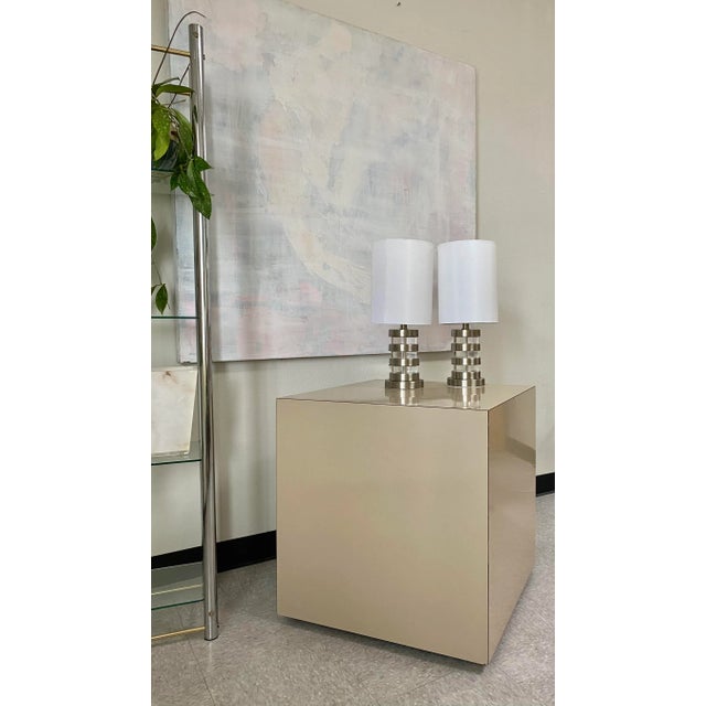 Postmodern blush colored laminate cubes on casters. All wood, custom-made side tables or nightstands. Both are sturdy with...