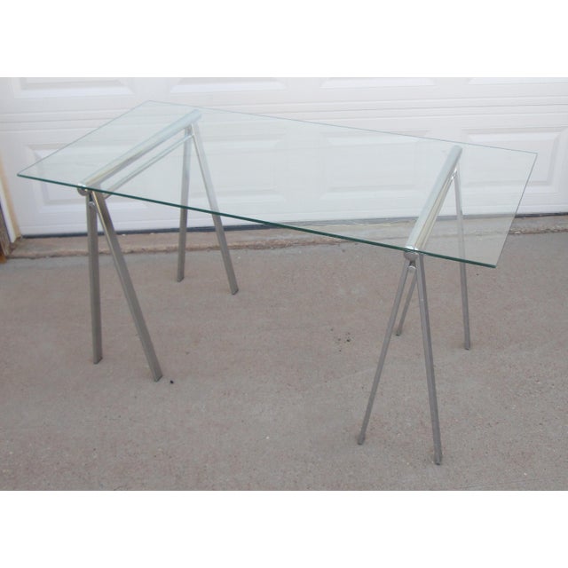 Vintage mid century modern chrome and glass sawhorse desk / table. The table top measures approximately 56 inches long,...