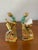 Charming vintage figural “Bookworm” cast iron bookends featuring a whimsical scholar/reader seated on stacked books while...