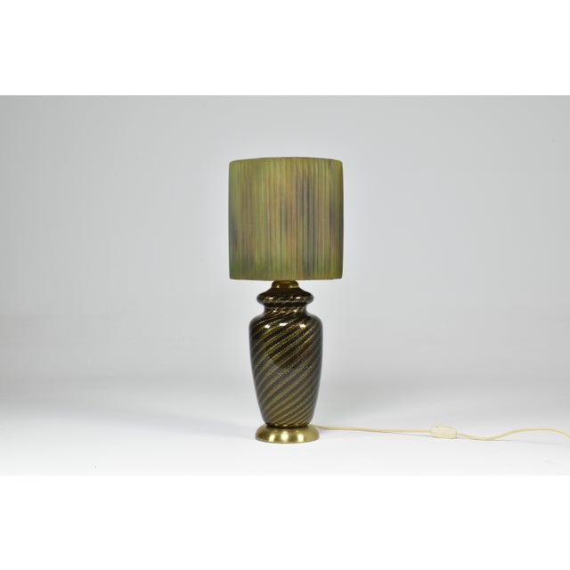 A beautiful mid-century vintage table lamp by notable Italian designer Tommaso Barbi circa 1970's. This stand-out lighting...