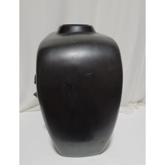 Vintage Cast Bronze Japanese Vase from thr Showa Period, dating after 1921. Large and very heavy in weight. Features a...