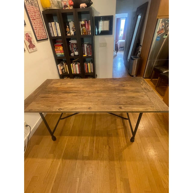 Restoration Hardware Flatiron oak distressed table with removable metal base on casters plus 6 Hudson Grey leather chairs...
