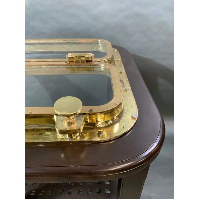 Solid brass ships porthole table. This is a large and substantial ships porthole fitted to a bar height table with four...