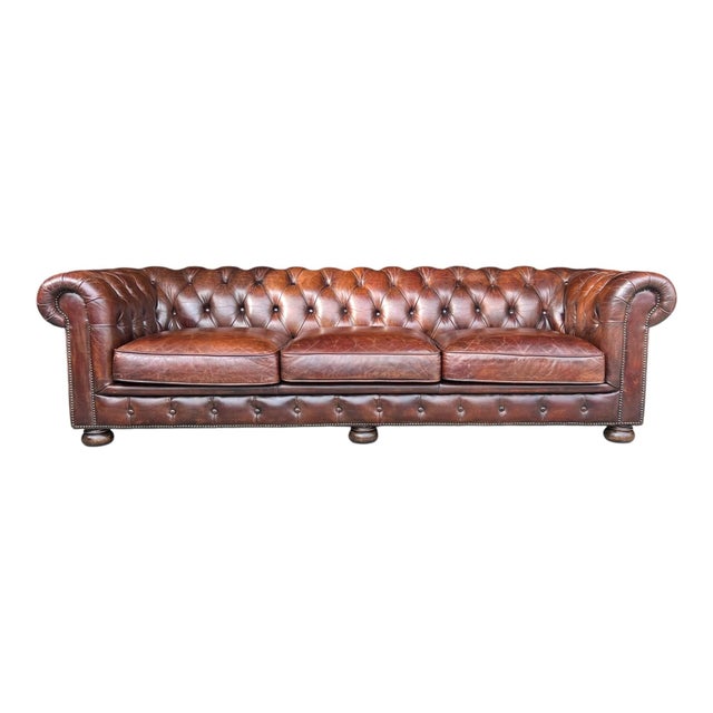 This classic Chesterfield sofa showcases timeless elegance and exceptional craftsmanship. Upholstered in genuine leather,...