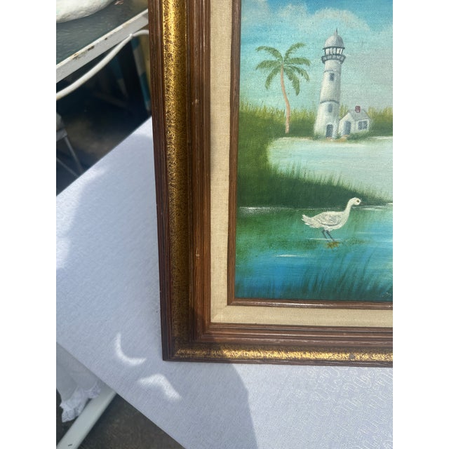 Up for consideration is a beautiful vintage lighthouse and egrets seascape painting on canvas, signed by the artist, and...