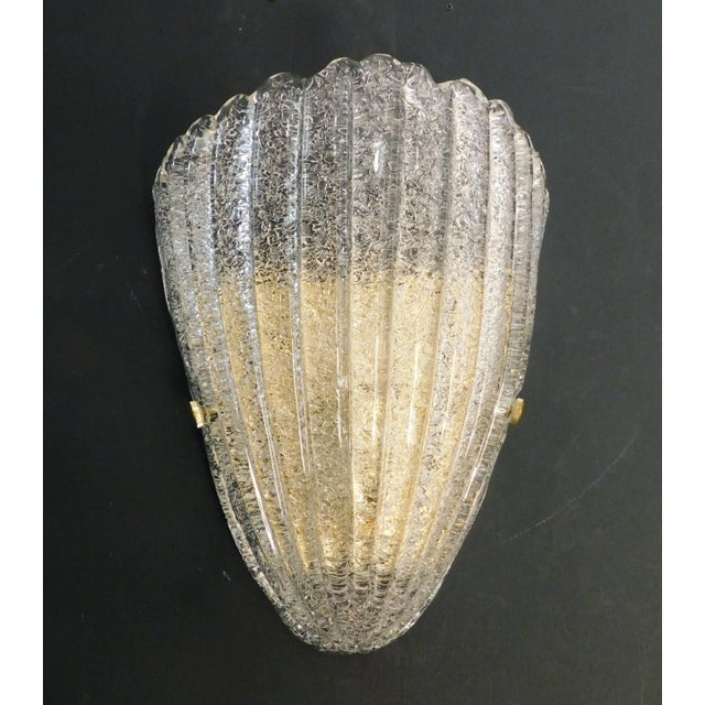 Italian wall light with a Murano glass shield hand blown in Graniglia technique to produce granular textured / Made in...