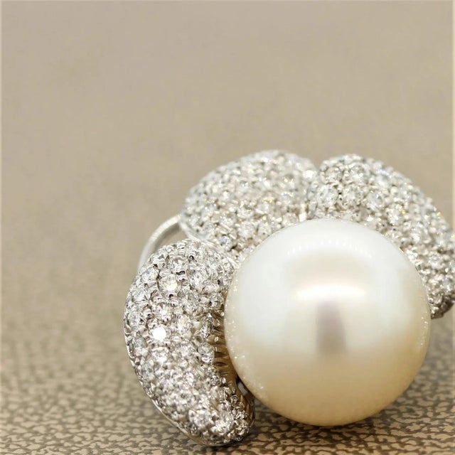 A fantastic and large pair of matching 15mm South Sea pearls feature on these floral earrings. They are perfectly rounded,...