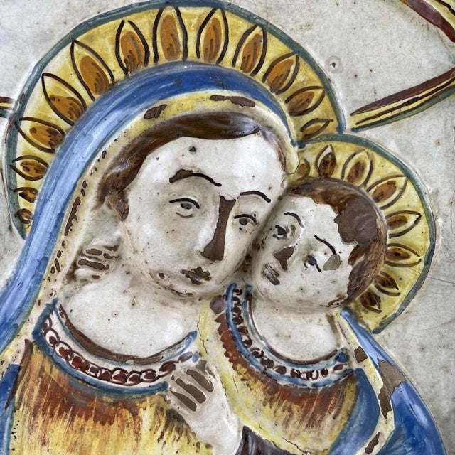 Madonna and Child in Enamelled Terracotta, 1600. This rectangular devotional plaque features a delicate polychrome image...