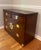 Elevate your dining or living space with this exceptional vintage Chinoiserie-style rolling bar cabinet and server by...