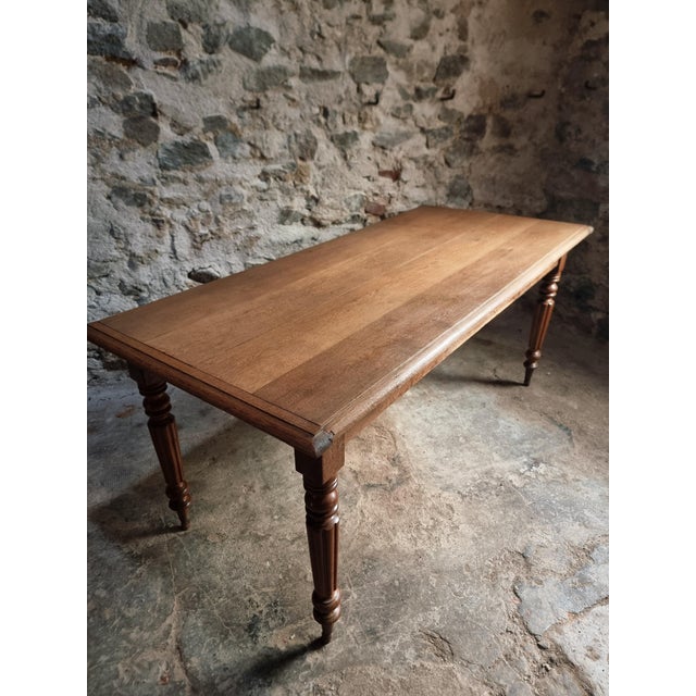 Antique oak dining table from France, dating from the early 20th century. The table is made from selected oak and features...