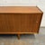 Wood Long Danish Modern Teak Low Sideboard With Sliding Doors, Circa 1960s For Sale - Image 7 of 8