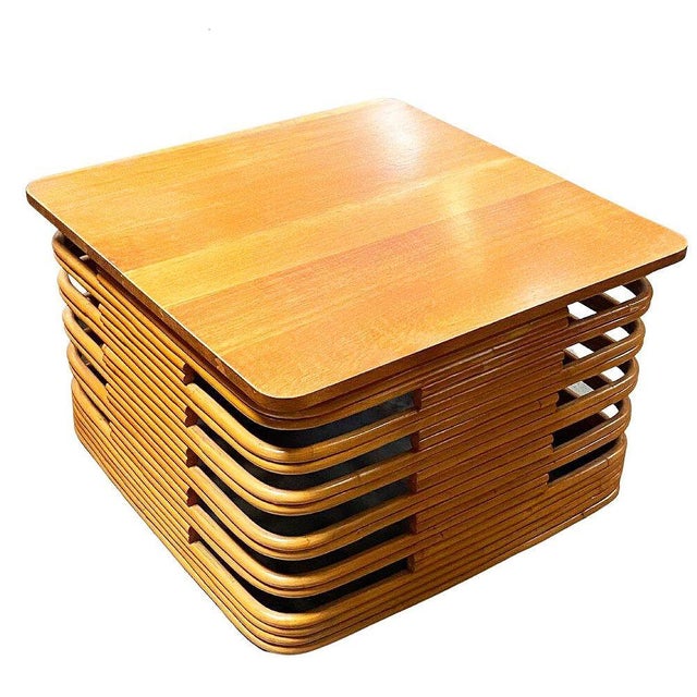 Rare Tall 18.5" Tall Mid-century coffee table features a striking, stacked rattan sculptural base constructed from...