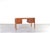 This Danish desk from the 1960s, manufactured by Domino Møbler, represents a typical approach to furniture design in the...