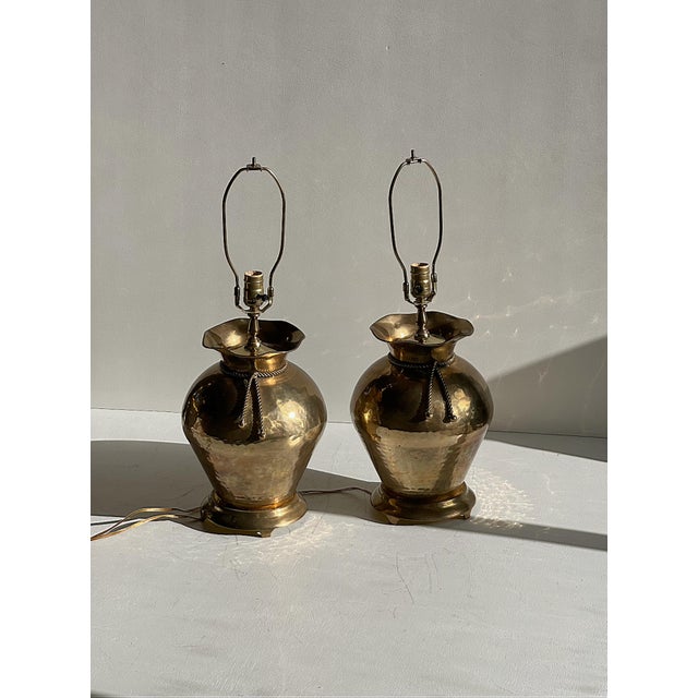 This elegant pair of vintage Italian brass table lamps dates to the 1970s and showcases the refined craftsmanship and...