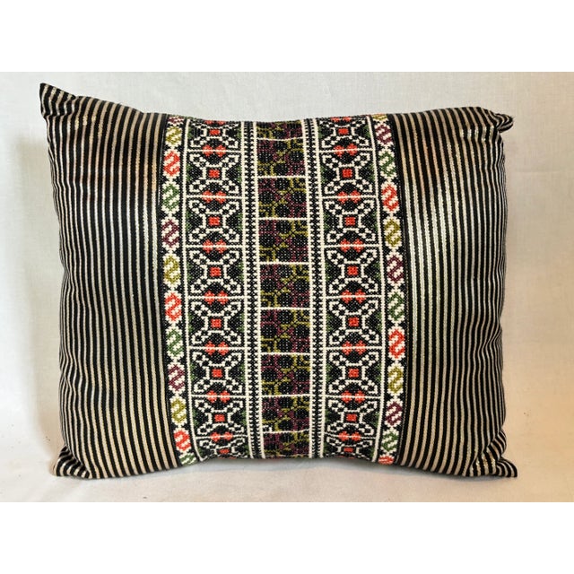 This beautiful black pillow has silver stripes with a gold border. Pillow insert included.