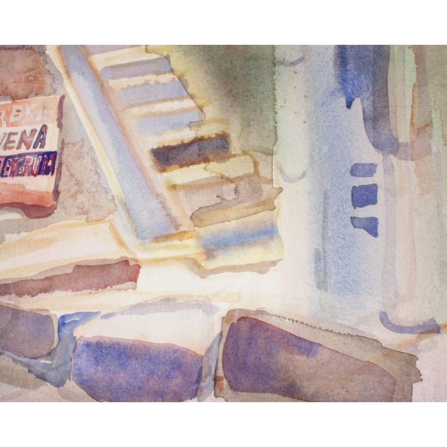 A 1988 watercolor painting of a city by the American artist Virginia Brooks. The vibrant scene depicts building exteriors...