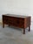 This stunning low storage unit exhibits a rectangular form with clean geometric contours. Four wide parallel drawers glide...