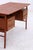 Vintage desk by Gunner Nielsen for Tibergaard from the 1960s with clean lines and a warm teak finish. The practical layout...