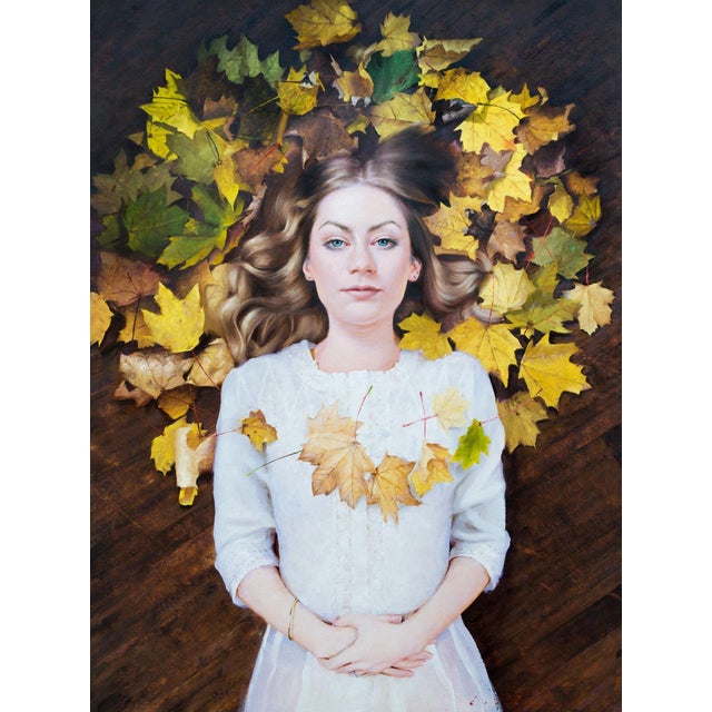 This oil painting features a serene figure surrounded by a vibrant arrangement of autumn leaves, creating a striking...