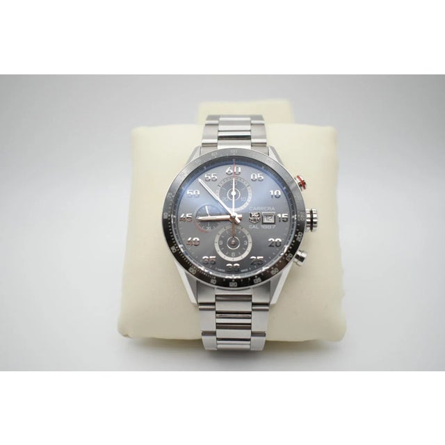 This is a Tag Heuer Carrera 1887 Chronograph in 100M watch. The box is included with purchase (5.5" X 5.5" X 3.75")