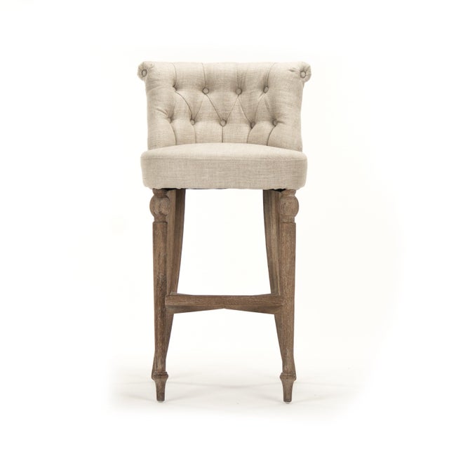 The Amelie Bar Stool from Zentique brings the beloved Amelie slipper chair's charm to bar height. A petite button-tufted...