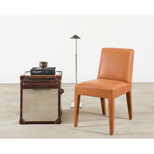 A refined equestrian-style inspired "Dalton" dining chair or side chair designed by Ralph Lauren. The Dalton chair...