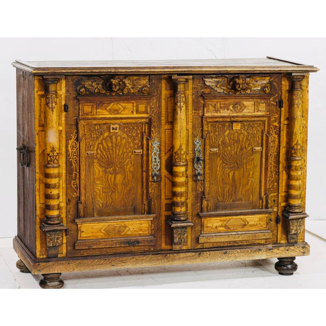 A bold and architecturally scaled German Renaissance Revival cabinet, dating to the late 19th century, richly executed in...