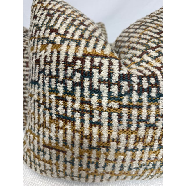 Custom pair of 22" pillows covered in Osborne & Little "Caraballo Zemu" in cream spice fabric. These pillows have tapered...