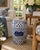 A classic blue and white porcelain garden stool, decorated with traditional Chinese motifs and stylized floral elements....