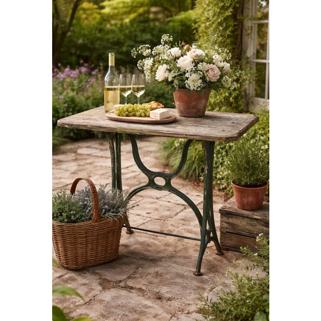 Originally a sewing machine table base, this cast-iron piece now functions beautifully as a garden table or, for the right...