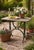 Originally a sewing machine table base, this cast-iron piece now functions beautifully as a garden table or, for the right...