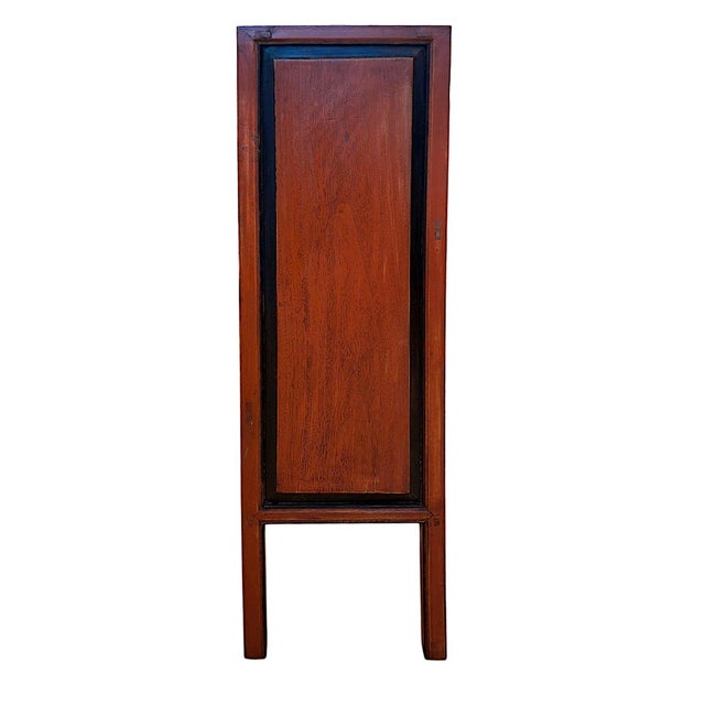 This 1920s Chinese wedding cabinet is an example of an antique lacquered storage piece, likely originating from Fujian, an...