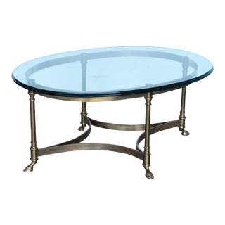 1970s Hollywood Regency Brass and Glass CoffeeTable With Hooved Feet For Sale