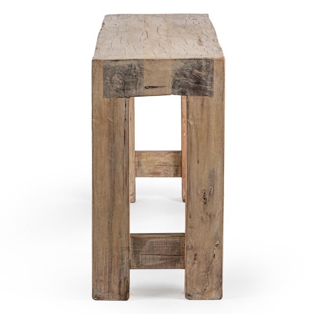 Salvaged wood beam console table with a substantial silhouette, weathered texture, and naturally aged character. Thick...