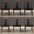 A set of six mid century modern solid teak dining chairs with black vinyl back rests and seats designed by Henning...