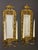 Pair of narrow, rectangular gilt bronze girandoles with beveled mirror and twin candelabra, circa 1890. Ornately decorated...