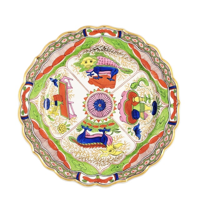 A Regency-period Worcester porcelain plate of fluted and scalloped form, decorated in the long-established “Dragon in...