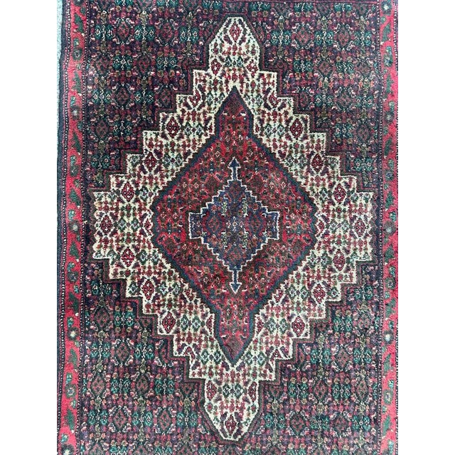Pretty small seneh rug with beautiful Herati geometrical design and nice colours, entirely hand knotted with wool on...