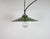 Vintage industrial enamel pendant lamp from the 1950s. It features a green enamel shade with white enamel interior and a...