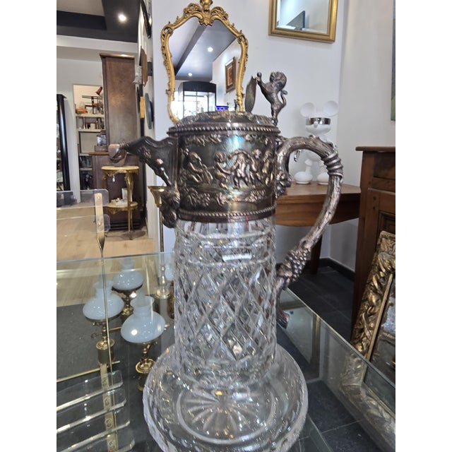 An elegant and imposing cut crystal wine decanter with a 925 sterling silver mount, attributed to the renowned portuguese...