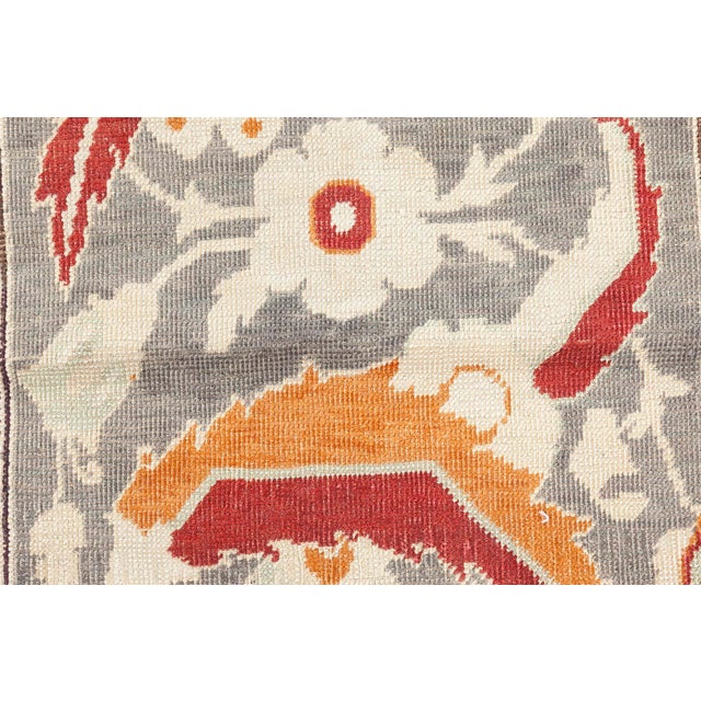 A magnificent example of Ottoman textile artistry, this antique Hereke rugwoven circa 1880is a celebration of intricate...