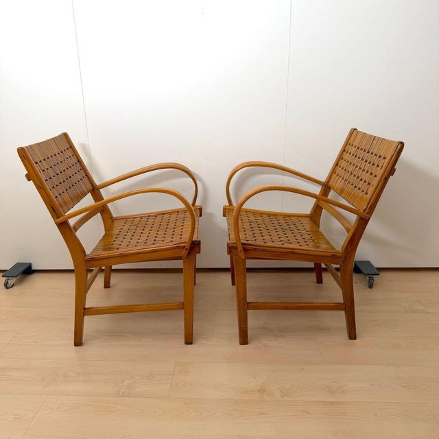 Set of two Bauhaus / Mid-Century armchairs by Gelenka from Germany, circa 1950. Curved beech wood armrests. Restored...