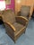 Pair of woven wicker armchairs in colonial style with lacquered wood armrests